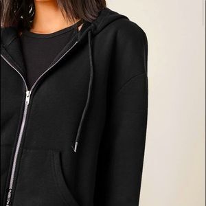 Black Zip-up jacket.